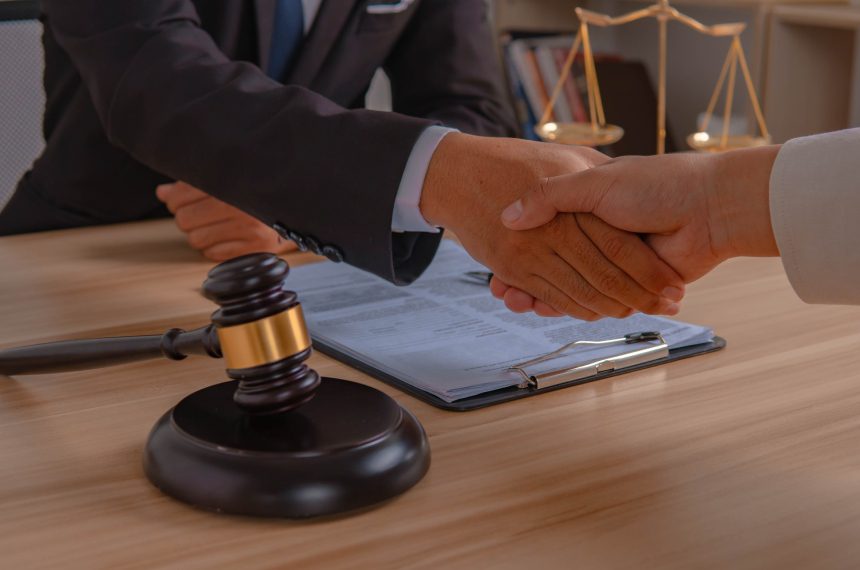 New Project (28) Lawyers shaking hands, legal agreement.